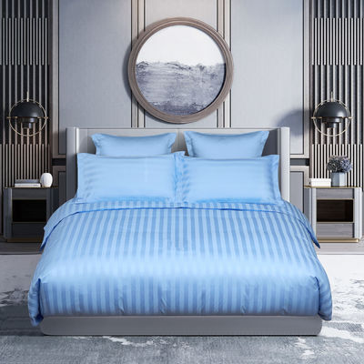 Lençóis de cama de algodão 100% em linhas azuis e brancas